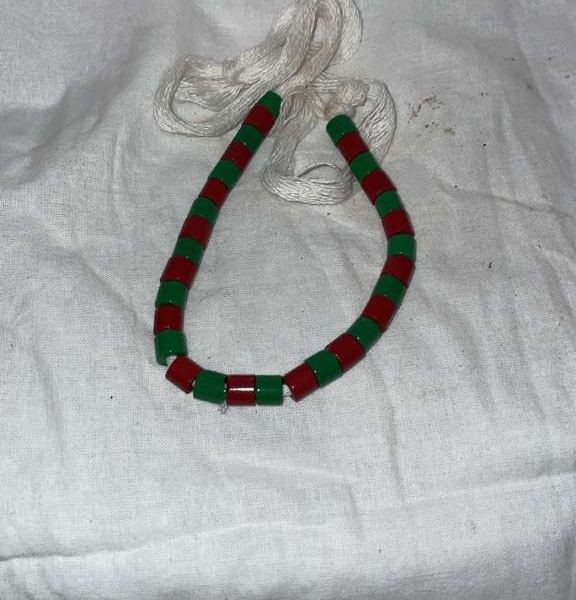 Ifa bracelet with large red and green beads